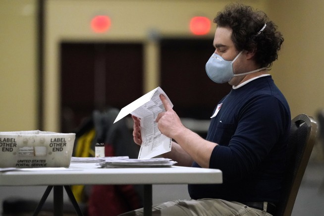 Election officials scramble to count ballots in key states