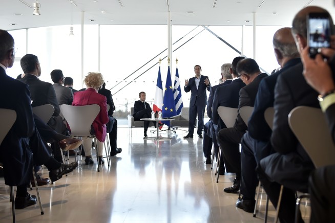 Macron ends Greek visit with surprise stroll through town