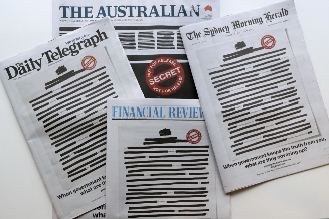 Australian papers redact front pages to expose govt secrecy