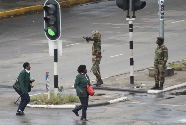 The Latest: Zimbabwe war vets group wants Mugabe recalled