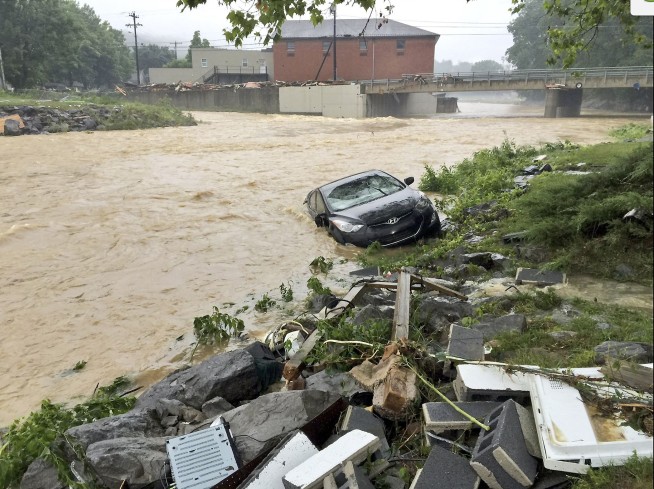 14 dead in West Virginia floods; focus on search and rescue