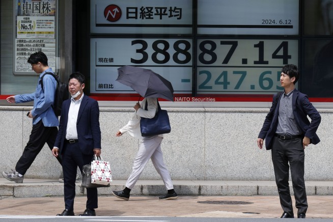 Stock market today: Asian shares are mostly lower ahead of Fed decision on interest rates