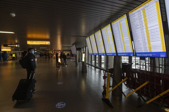 Several EU nations halt UK flights, fearing virus variant