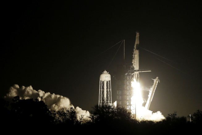 Crew capsule rockets toward space station with test dummy