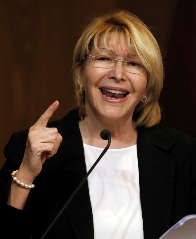 The Latest: US hits Venezuela president with sanctions