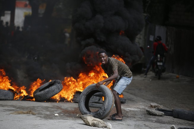 Haiti's prime minister calls for calm as violent protests seek his ouster