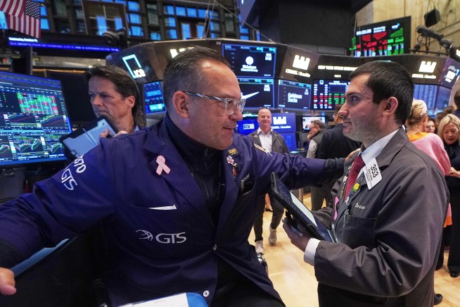 Most US stocks rise after swinging through another erratic day