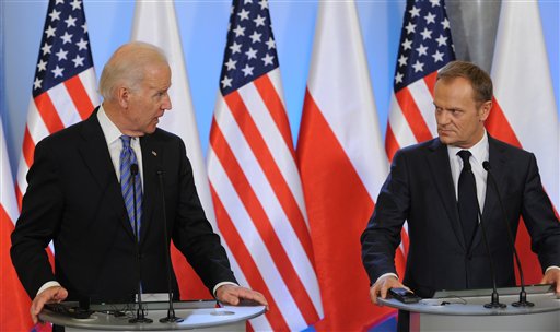 Pushing back on Russia, Biden vows more sanctions