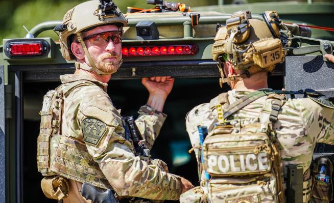 Suspect in Texas shooting wore 'Property of Allah' clothing and Iranian flag emblem, AP source says