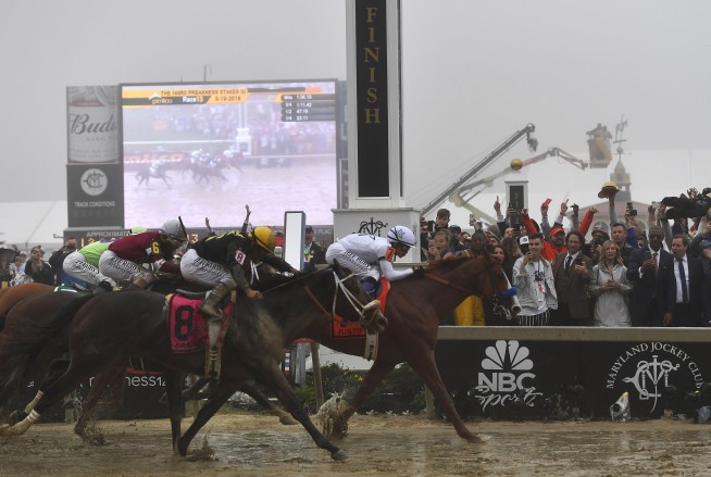 Justify wins foggy Preakness, keeps Triple Crown bid alive