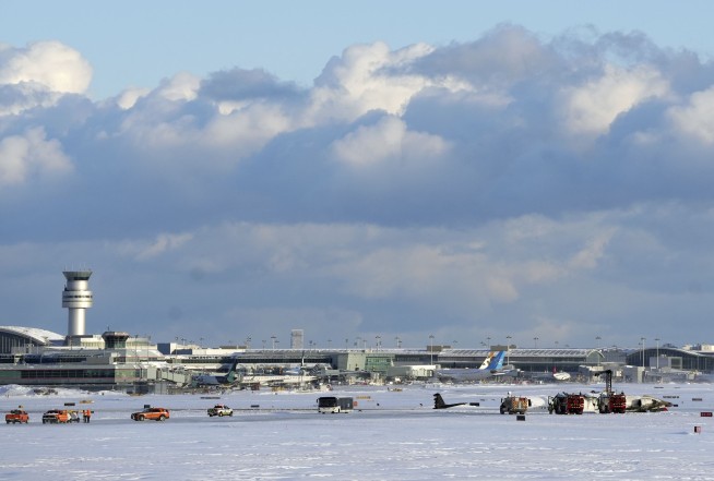 Delta jet flips upside down on a snowy Toronto runway and all 80 aboard survive