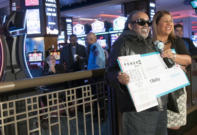 Retired government worker revealed as $343M Powerball winner