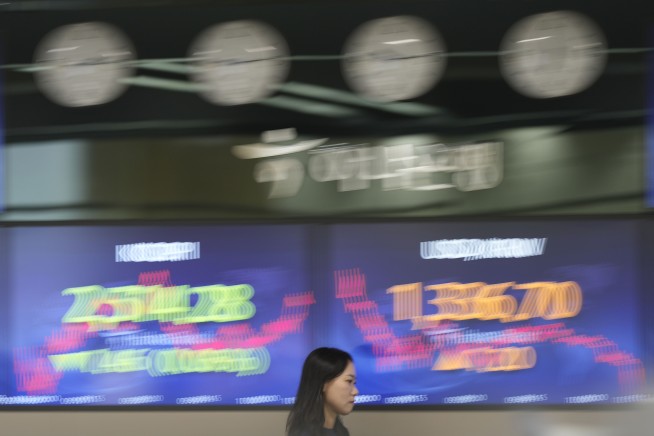 Stock market today: Asian shares are mixed ahead of Fed Chair speech and Nvidia earnings