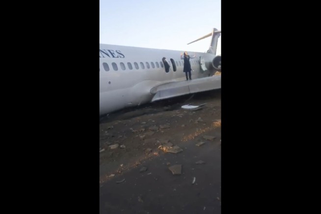 Aging Iran airliner crash-lands on highway, injuring only 2