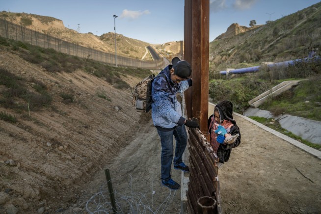 AP FACT CHECK: Trump's false statements to cheering troops