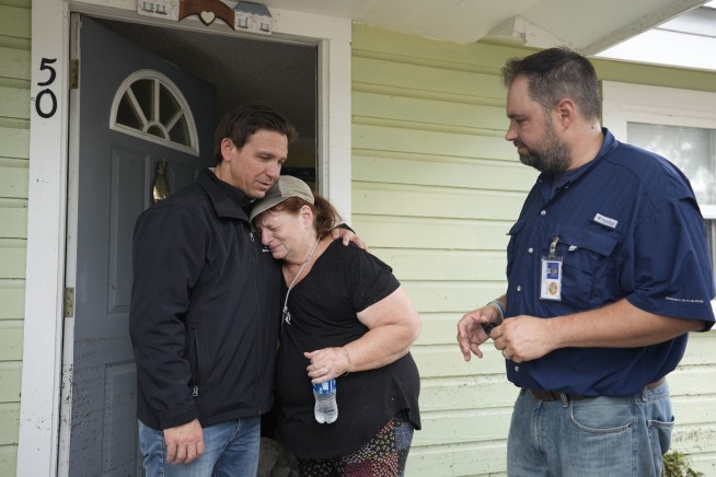 Residents pick through the rubble of lost homes and scattered belongings in Hurricane Idalia's wake