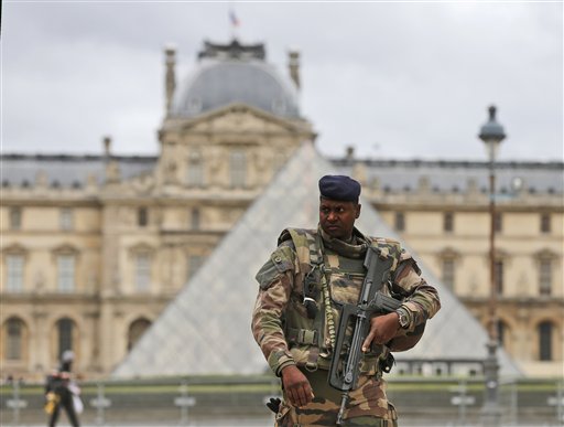 French hunt 2nd fugitive, launch new airstrikes on IS