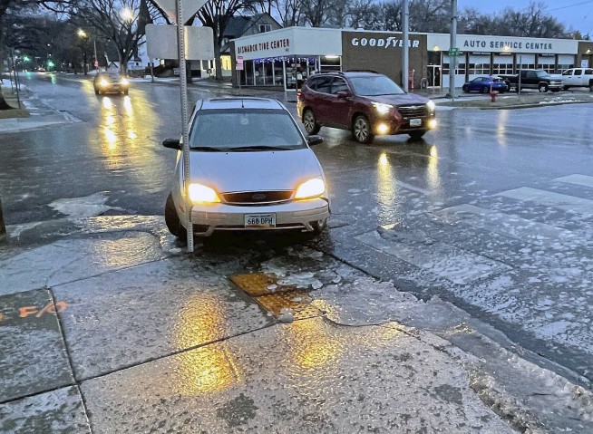 Ice storms and blizzards pummel the central US a day after Christmas