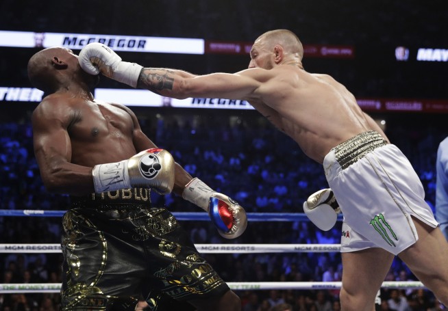 Mayweather dominates McGregor in late rounds to go 50-0