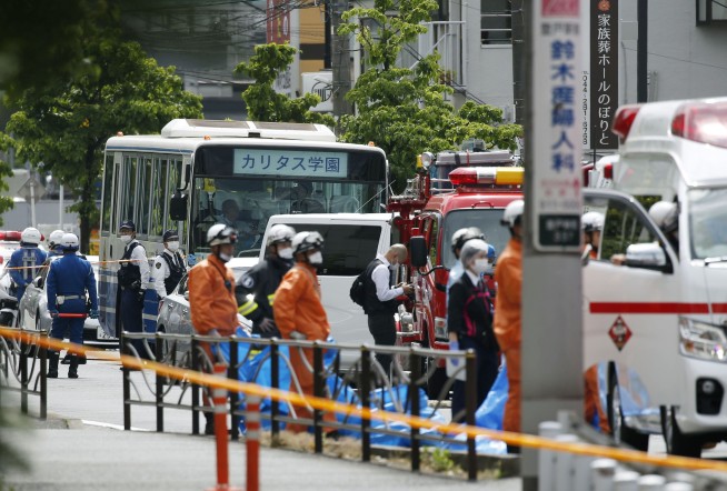 The Latest: Abe says he is outraged over Japan stabbings