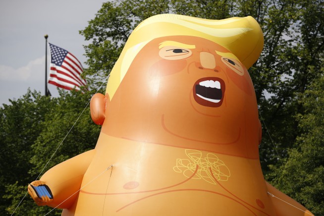 The Latest: Protesters show off diapered baby Trump balloon