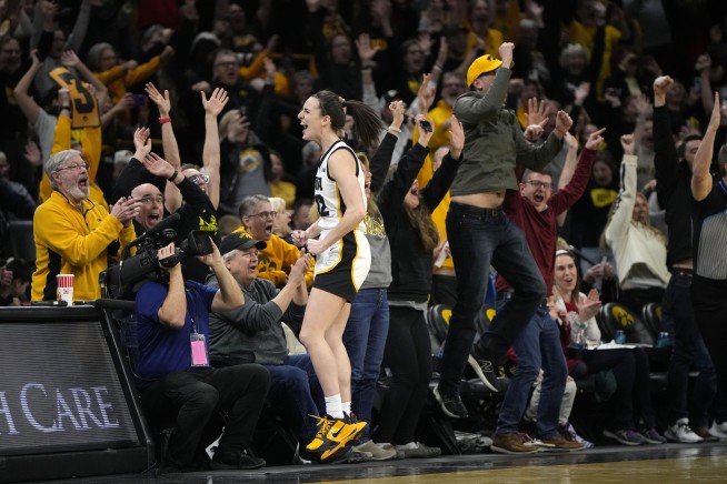 Caitlin Clark of Iowa breaks the NCAA women's career scoring record with a signature 'logo 3'