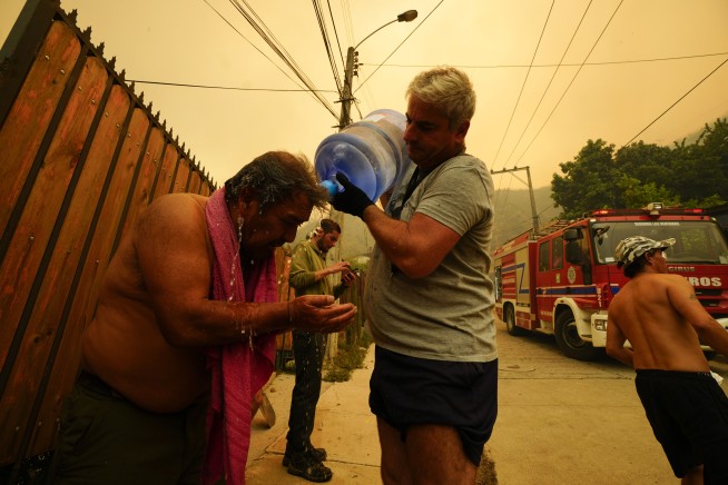 46 reported dead in Chile as forest fires move into densely populated central areas