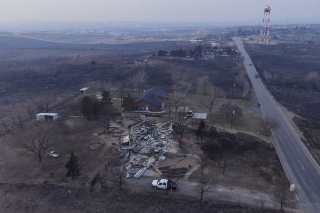 Wildfire grows into one of largest in Texas history as flames menace multiple small towns