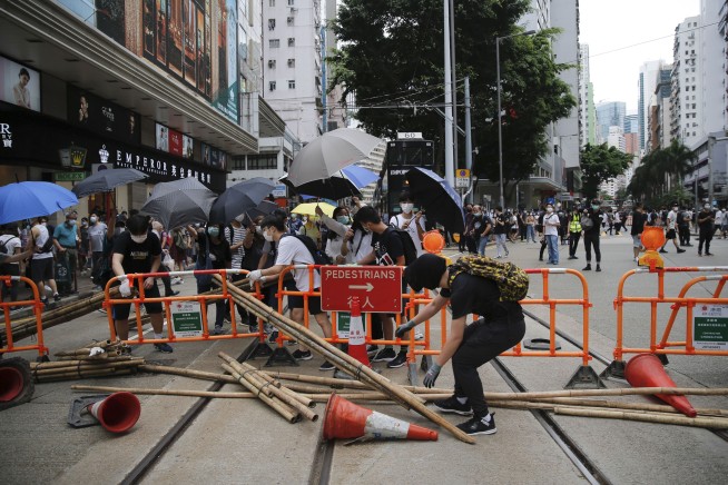 Hong Kong police fire tear gas, water cannon at protesters