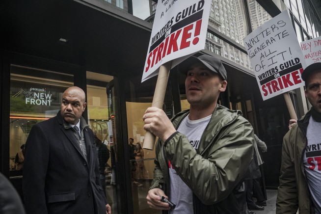 Late-night TV shows go dark as writers strike for better pay