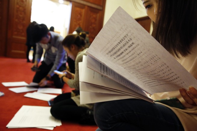 In rare step, China bars 2 Hong Kong lawmakers from office