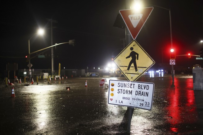 Eastern U.S. braces for flooding while fire-damaged California city now faces mudslides