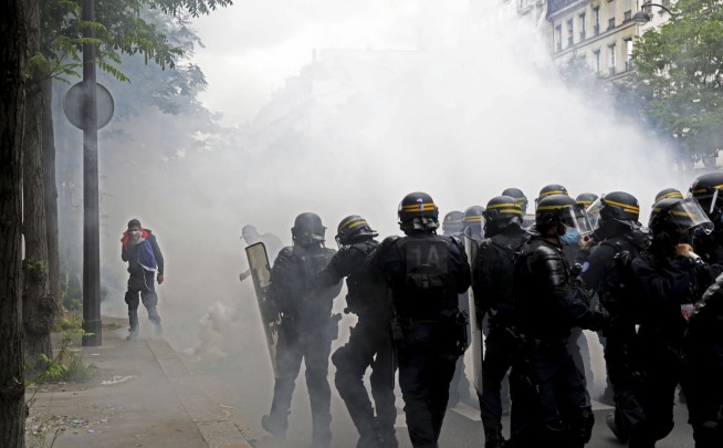 French police clash with anti-virus pass protesters in Paris