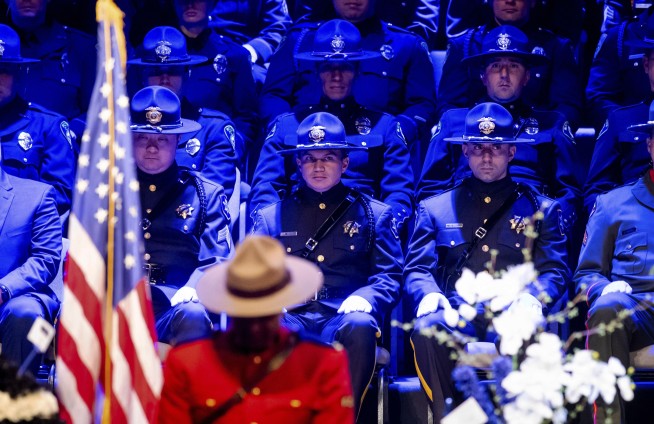 Slain police officer called 'American hero' at his funeral