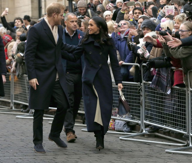 Prince Harry, Meghan Markle greet fans in English city