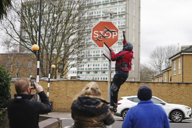 Now you see it, now you don't: Banksy stop sign taken from London street soon after it appears