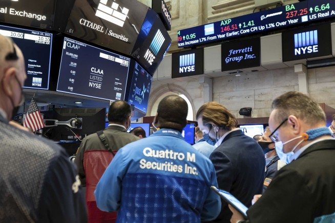 Stocks mostly climb, except tech, as inflation worries ease