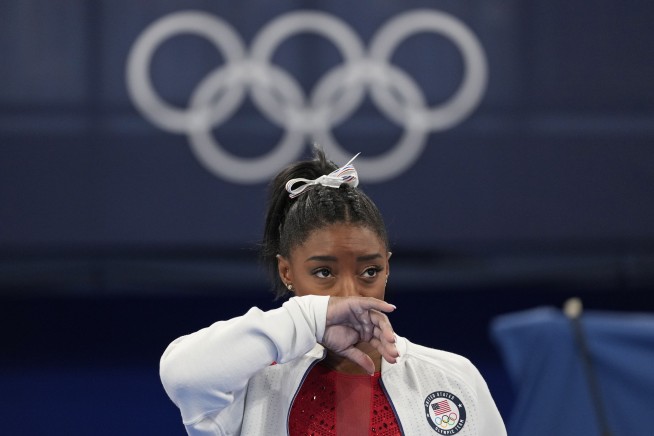 Biles out of vault and uneven bars; beam and floor possible