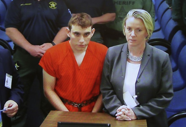 Florida gunman had extra ammo at school, fired for 3 minutes