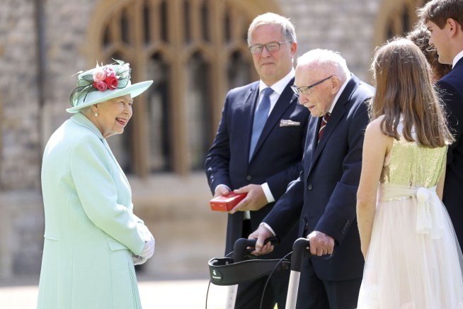 Queen makes Capt. Tom a knight at 100, no kneeling required