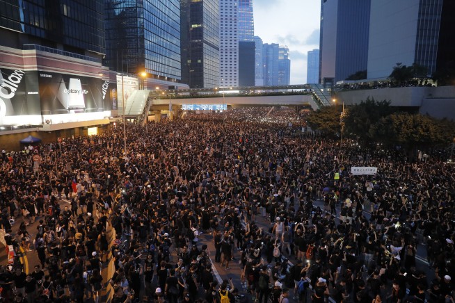 Massive protests draw apology from Hong Kong leadership