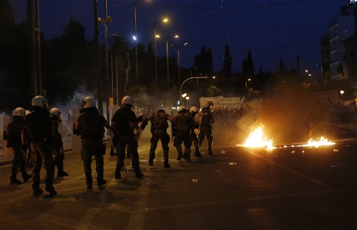 Greek lawmakers pass austerity bill despite dissent