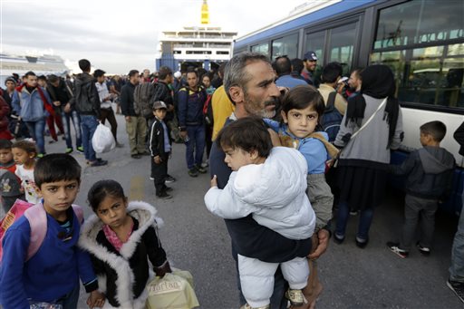 The Latest: 2 dead, 47 migrants rescued off Greek island