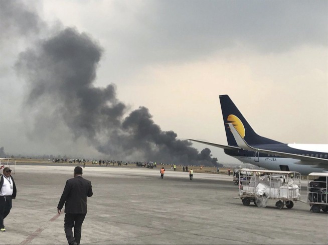 Plane carrying 71 people crashes, catches fire in Kathmandu