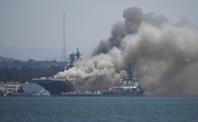 Navy charges sailor with setting fire that destroyed warship