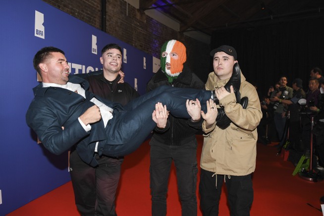 Member of Irish rap trio Kneecap charged with a terror offense in the UK