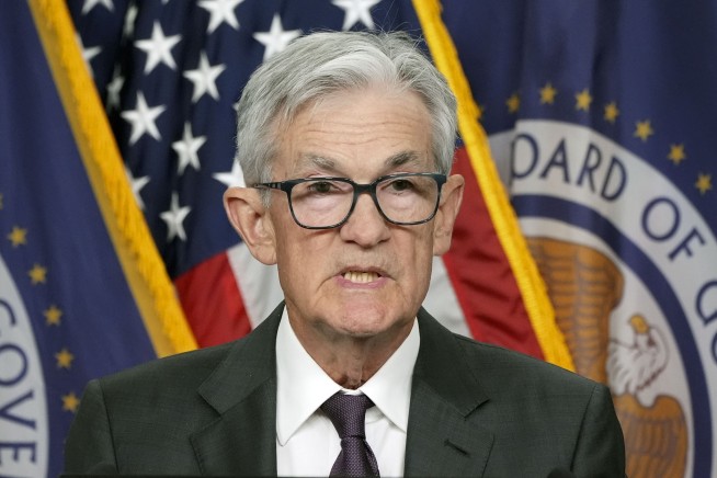 Fed hold rates steady, sees inflation as 'elevated,' as Powell declines comment on Trump