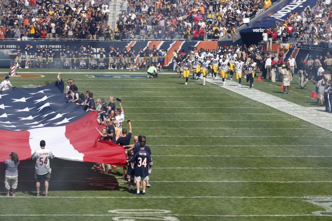 The Latest: More than 200 NFL players don't stand for anthem