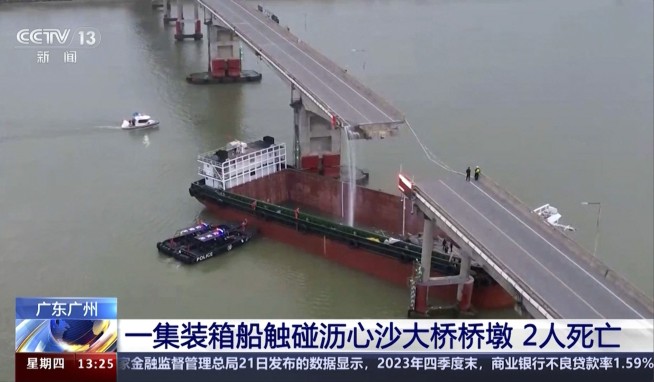 Container ship hits bridge in south China, killing 5 and knocking section of roadway into the water