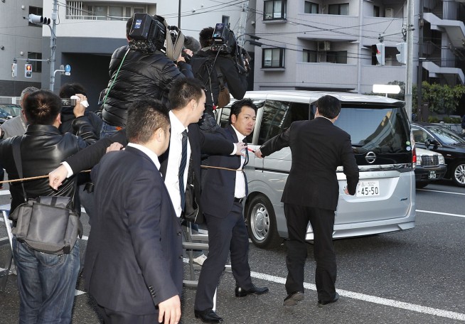 The Latest: Tokyo detention center confirms Ghosn is inside